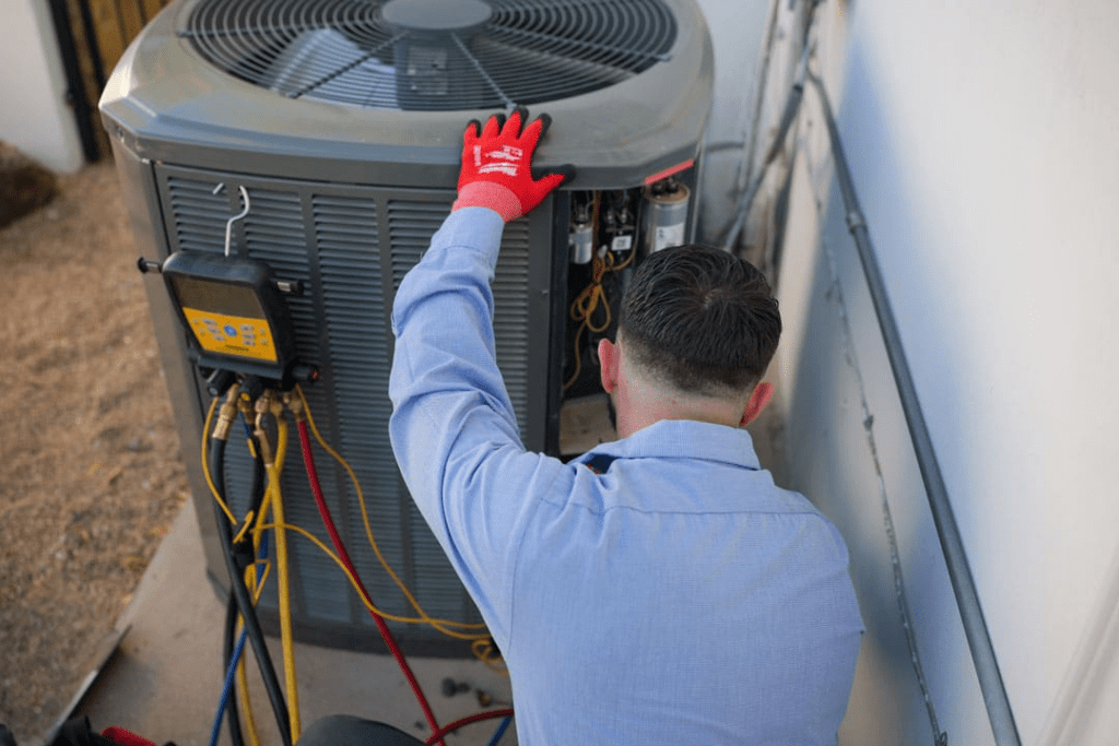 ambient edge employee working on an ac unit