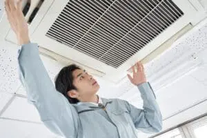 FAQs - Ambient Edge man-installing-commercial-air-conditioner