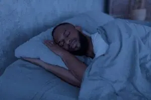 black man trying to sleep