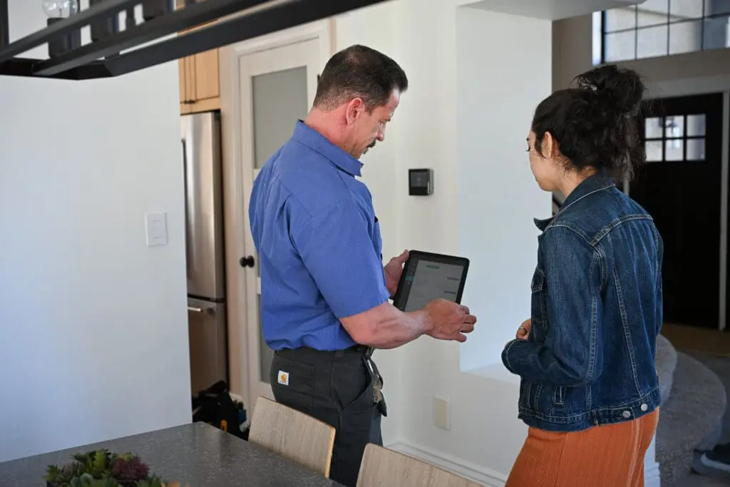 Ambient Edge plumber consulting with a customer