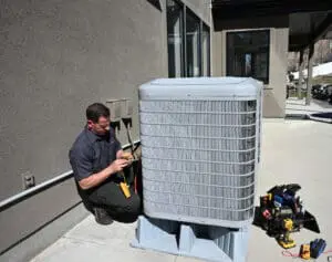 ambient edge employee working on an ac unit