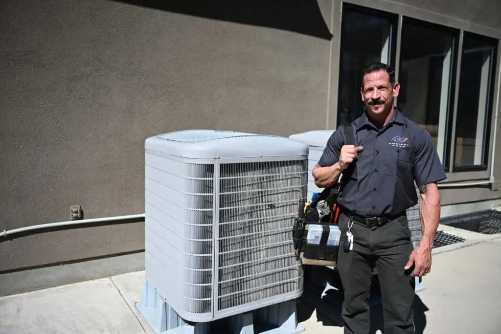 ambient edge employee posing in front of an ac unit