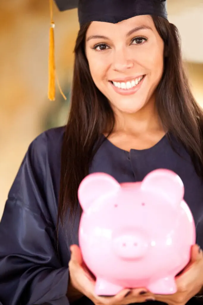 Graduate,Woman,Holding,A,Piggybank,With,Her,Education,Savings
