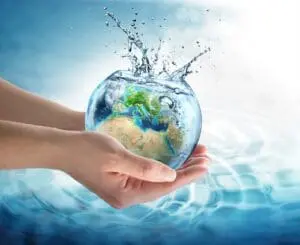 person holding a sphere of water