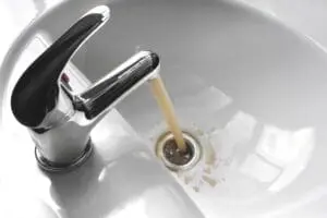 brown water coming out of a bathroom sink
