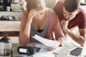 A couple worried about bills.