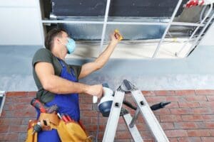 repair technician opening air vent