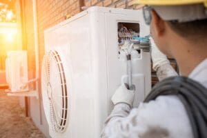 hvac technician installing new ac unit