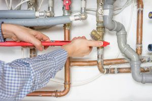 technician works on home heating system