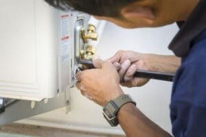 hvac technician makes repairs