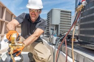 technician installs new HVAC unit