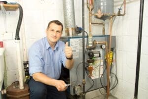 technician installs new furnace