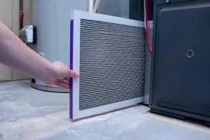 heater technician replaces unit filter