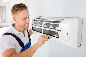 technician completes replacement ac unit installation