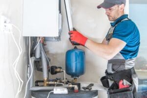 technician installs replacement heating unit