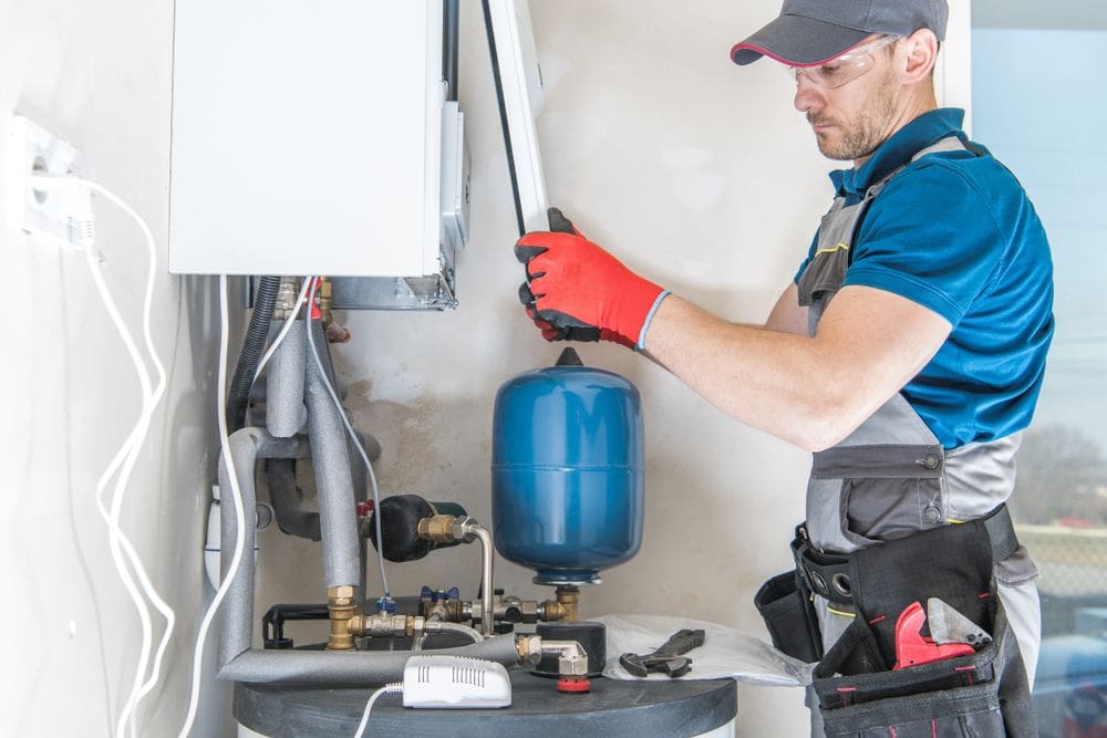 Water Heater Installation - Ambient Edge HVAC Technician Repairs Broken Heater