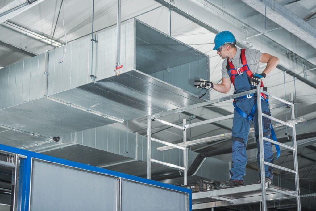 Commercial HVAC Service and Installation in Las Vegas, NV - Ambient Edge technician-installing-hvac-system-commercial-building