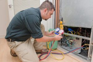 HVAC technician charging heat pump refrigerant