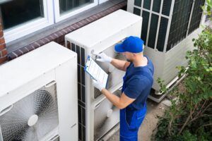 electrician inspecting AC unit