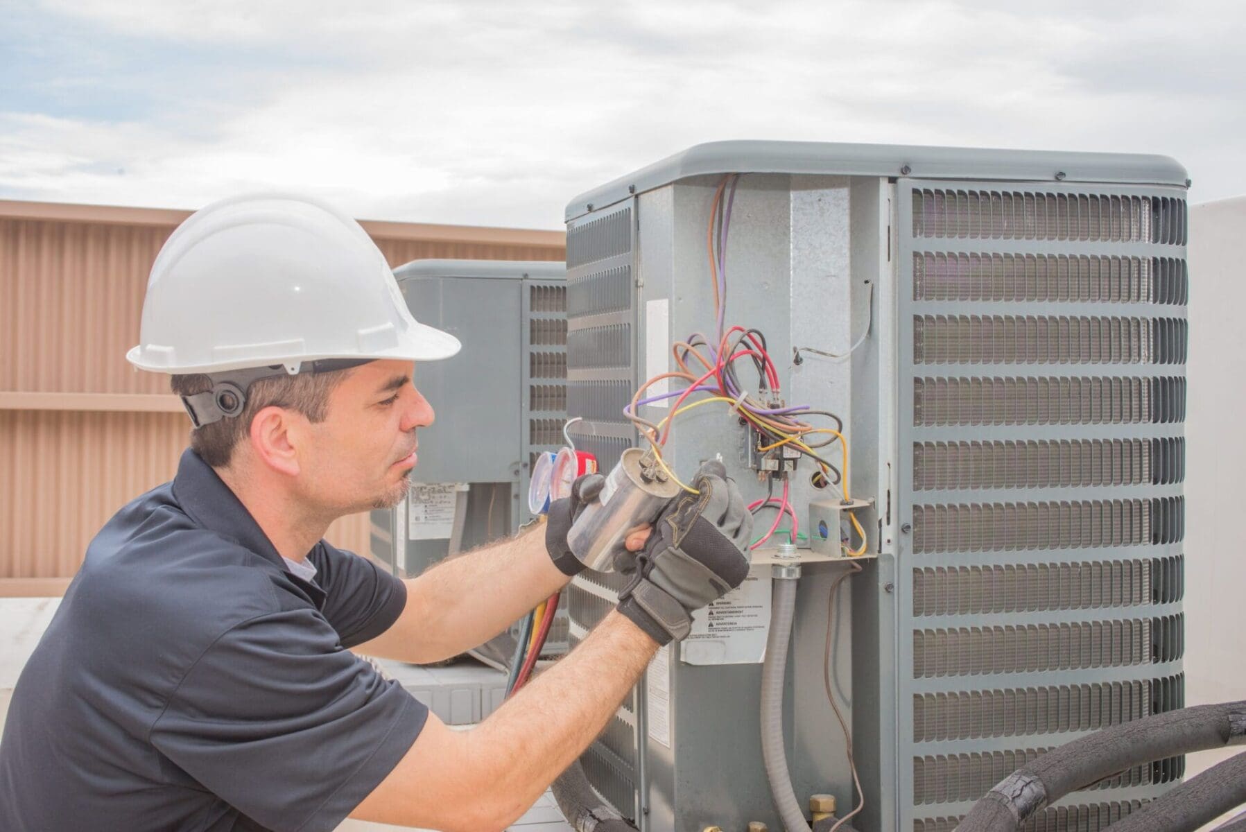 hvac-technician-working-on-capacitor