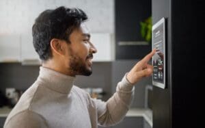 man adjusting temperature