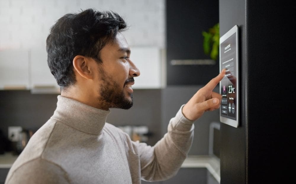 man adjusting temperature