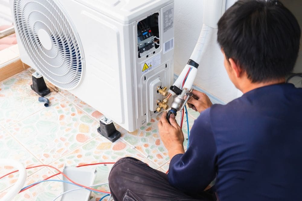 Industry-Leading AC Installation & Replacement Solutions - Ambient Edge tech installing air conditioning filter in Bullhead City