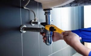 Plumber Fixing a Pipe or Clogged Drain