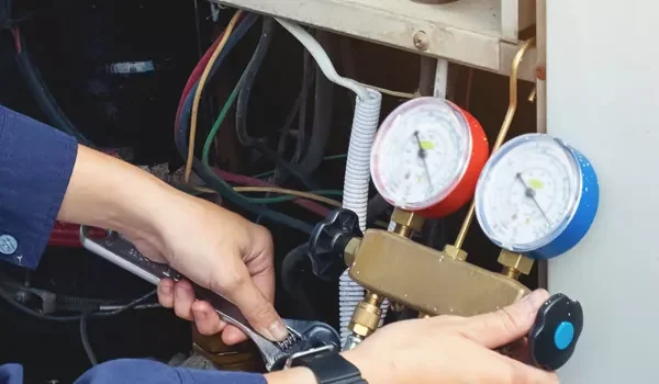 Ambient Edge employee using a wrench