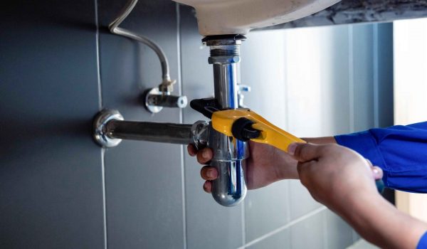 Plumber Fixing a Pipe or Clogged Drain